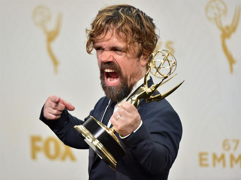 Peter Dinklage holding a wine glass
